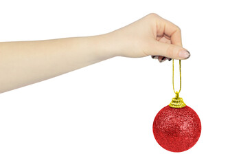 Christmas tree toy in outstretched hand isolated from background, Christmas tree decoration concept
