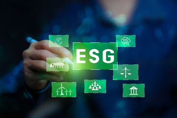 Businessman points at ESG icon,Environmental, social,Governance. Green energy icon around it. Green Energy Renewable Sustainable concept. Net zero emission Idea innovative.carbon neutrality in 2050.