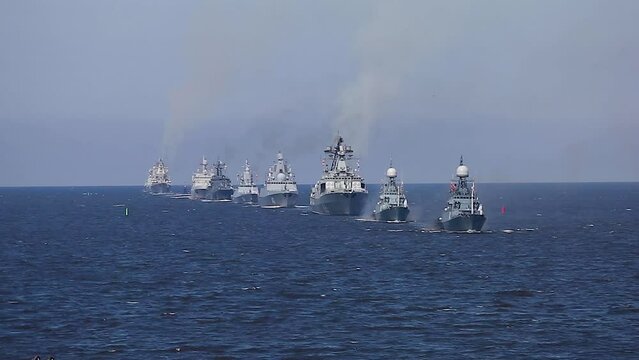 View of Russian Navy line ahead, modern russian military naval battleships warships in the row, northern fleet and baltic sea fleet, summer sunny day during the military exercise