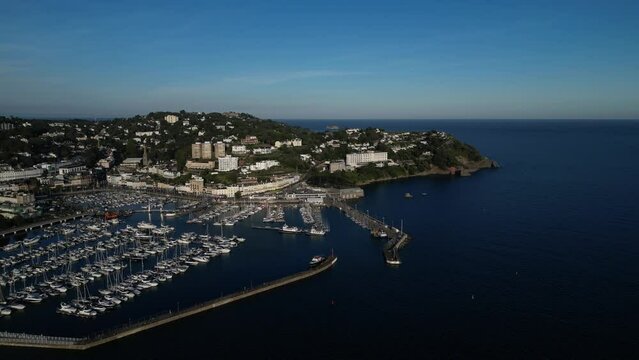 Torquay, Torbay, South Devon, England: DRONE VIEWS: A high angle view of the town of Torquay and its Marina. Torquay is a popular UK summer holiday resort and tourist destination.
