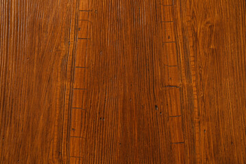 The textured structure of mahogany. Vintage wooden surface close-up. Wooden background