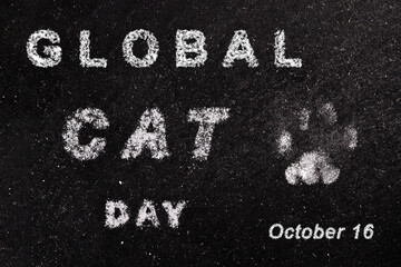 Global Cat Day Banner. International Cat Day Poster. Holiday concept with white chalk lettering typography and footprint of cat paws isolated on black chalkboard background