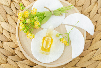 Small roll-on bottle with linden (tilia, basswood, lime tree) perfume oil. Natural beauty treatment.