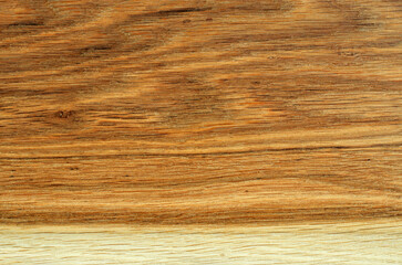 Oak wood texture close-up. Top view of an wooden board finished with hard wax oil. Natural background.