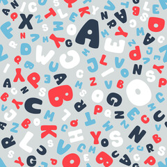 Vector seamless pattern of colorful funny letters on a gray background. Suitable for baby prints, kids room decor, wallpaper, wrapping paper, stationery, scrapbooking, etc.