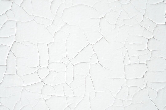 Cracked white paint on the wall, wall texture