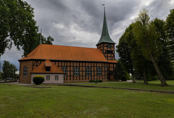 Church in Stegna on a cloudy and windy day, Żuławy, northern Poland