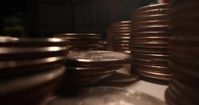 Many coins of American cents on dark background. Counterfeiting and profit increase concept