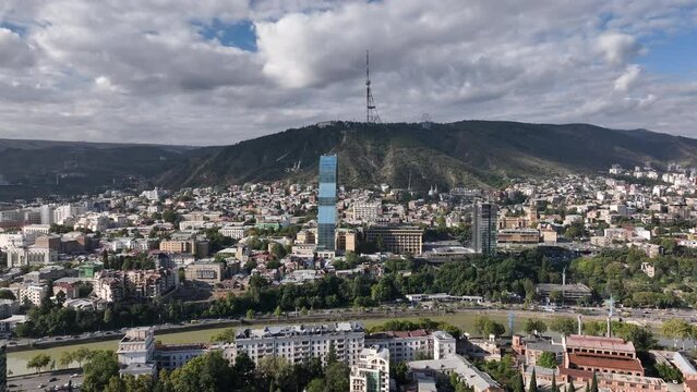 bilisi, Georgia - July 13 2023: Flying over Shota Rustaveli avenue in the center of city. Aerial view of The Biltmore Tbilisi Hotel