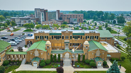 Aerial St Jude Catholic school with windows boarded up and under construction and Parkview hospital