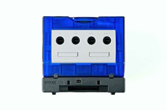 Neu-Ulm, Germany - September, 19, 2023: Nintendo Gamecube console with additional Gameboy Player. Front view, isolated on a white.