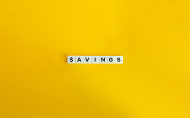 Savings Word on Letter Tiles on Yellow Background. Minimal Aesthetic.