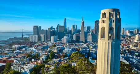 Gartenposter Aerial Coit Tower with San Francisco downtown in background and Oakland Bay Bridge © Nicholas J. Klein