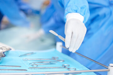 Hand, surgeon and metal tools for surgery in hospital, medical treatment and healthcare with help....