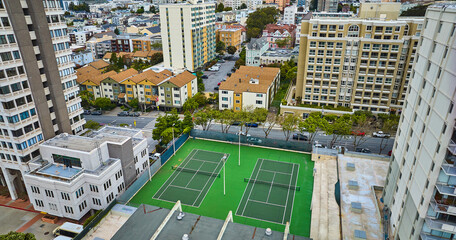 Aerial elevated apartment tennis courts in San Francisco city