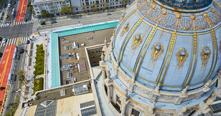Downward aerial view of gilded city hall roof in San Francisco