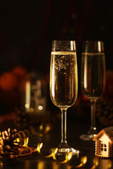 Two glasses with champagne in New Year Eve and Christmas style