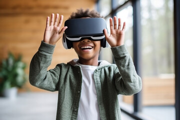 Cheerful African American elementary schoolboy gesturing while wearing vr glasses