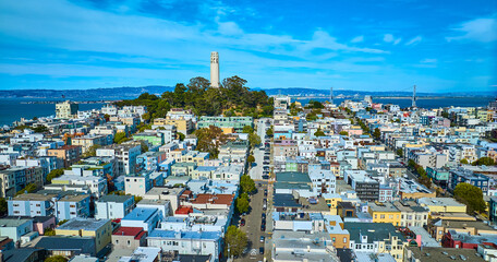 Aerial of houses and road leading to Telegraph Hill and Coit Tower with view of bay