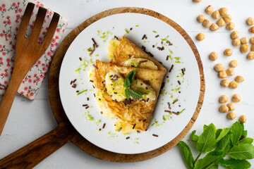 Crepe filled with pieces of banana marinated in lime juice.
