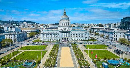 Straight on view of city hall aerial over Civic Center Plaza with blue sky and purple clouds