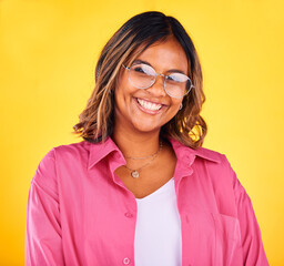 Happy, fashion and portrait of woman on yellow background with smile, confidence and cosmetics. Beauty, style and face of person with glasses in trendy clothes, stylish outfit and makeup in studio