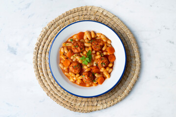 White bean stew with chorizo. Traditional dish of Spanish gastronomy from the Asturias region in the north of the country.