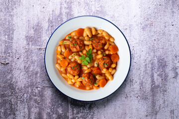 White bean stew with chorizo. Traditional dish of Spanish gastronomy from the Asturias region in the north of the country.