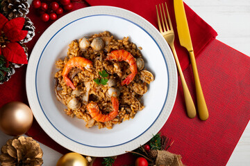 Spanish seafood paella with red shrimp and clams.
