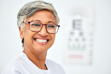 Senior woman, face and smile with glasses, vision and eye care in optometry clinic for eyesight...