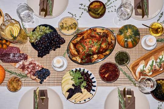Top view background image of festive dinner table for Thanksgiving with roasted turkey dish, copy space
