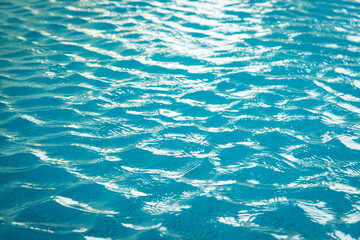 Blue water ripple reflection in the swimming pool