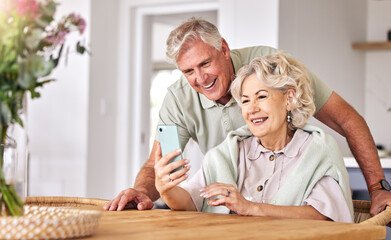 Senior couple, video call and home with phone, conversation and contact on social media in retirement. Happy elderly man, woman and webinar with smartphone, smile and hello in morning, house or table