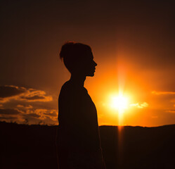 silhouette of a woman at sunset