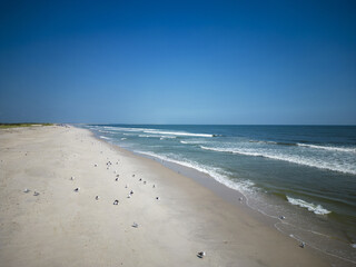 Drone view looking east at the sand and ocean at Gilgo Beach