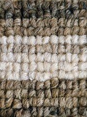 Knitted textured background with woven details.