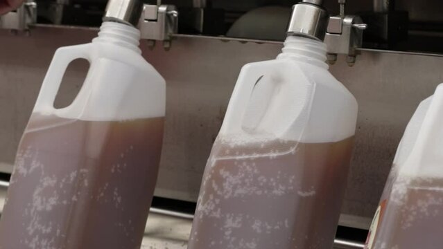 Filling Bottles of Fresh Apple Cider