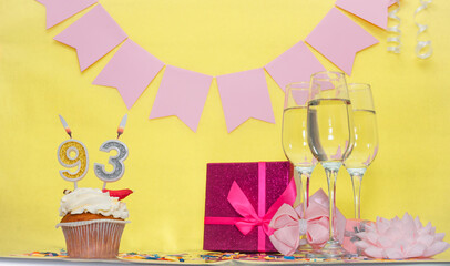 Date of birth with number 93. Festive pudding pie with a candle. Happy birthday decorations for a...