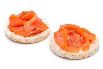Tasty Rice Cake Sandwiches with Fresh Salmon Slices Isolated on White. Easy Breakfast and Diet...
