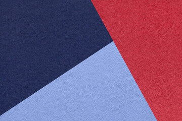 Fototapeta premium Texture of craft navy blue, red and very peri shade color paper background, macro. Vintage abstract cardboard