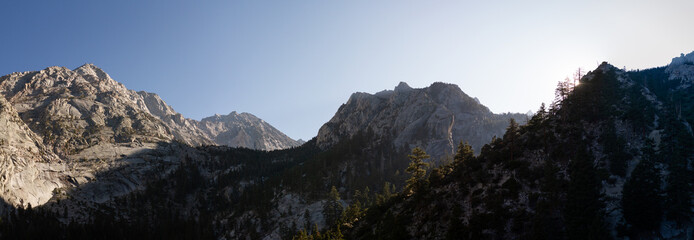 Panorama view of white granite mountains and blue sky in evening sun on Mount Whitney, america