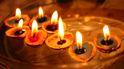 floating candles in a walnut shell