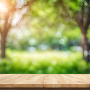 Empty wood table top and blurred view from green tree garden bokeh background