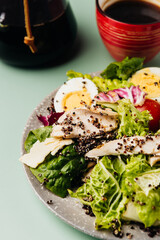 coffee and salad simple lunch on a bright fashionable barbie color