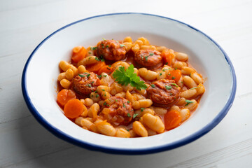 White bean stew with chorizo. Traditional dish of Spanish gastronomy from the Asturias region in the north of the country.