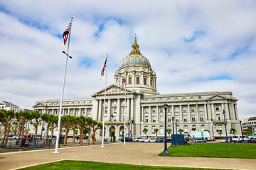 Betsy Ross and other American flags in front of San Francisco city hall building