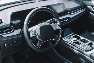 Car interior with auto dashboard panel. New automobile carbon cabin