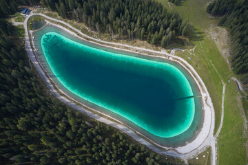 Montagnoli Lake. Aerial view of Trentino Montagnoli lake. Alpine lake in the mountains, top view....