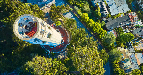 Aerial over Coit Tower with downward view of roof with red floor and stairs