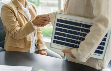 Handshake and business with solar panels green energy Business people working in green eco friendly office business meeting creative ideas for business eco friendly - obrazy, fototapety, plakaty